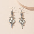 Guess Who Skull Dagger Earrings